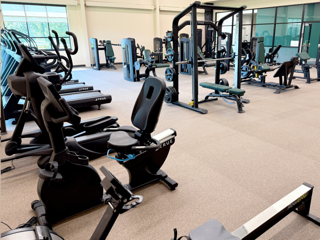 Commercial fitness room with TRUE cardio and strength equipment arranged for optimal performance.