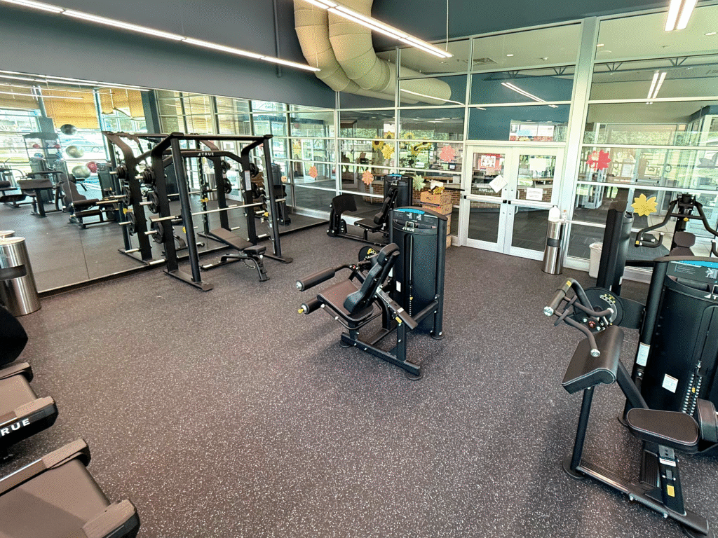 TRUE Fitness strength and cardio equipment installed in a bright, community fitness center.